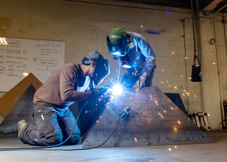 Forged in Metal: Mentorship Between Sculptor and Art Student