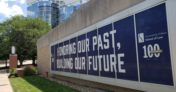 Akron Law centennial celebration banners around campus.