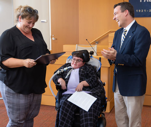 Megan Parker with her mother, Jaclyn Sims, and Akron Law Assistant Dean of Student Affairs Andrew Costigan.