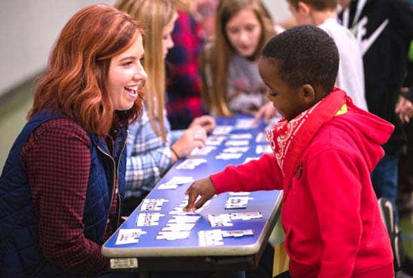 A student teacher at The University of Akron with a 8 year old student